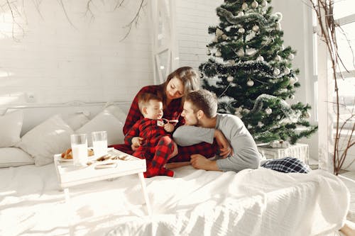 Free A Family in a Bedroom at Christmas Stock Photo