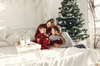 A Family in a Bedroom at Christmas