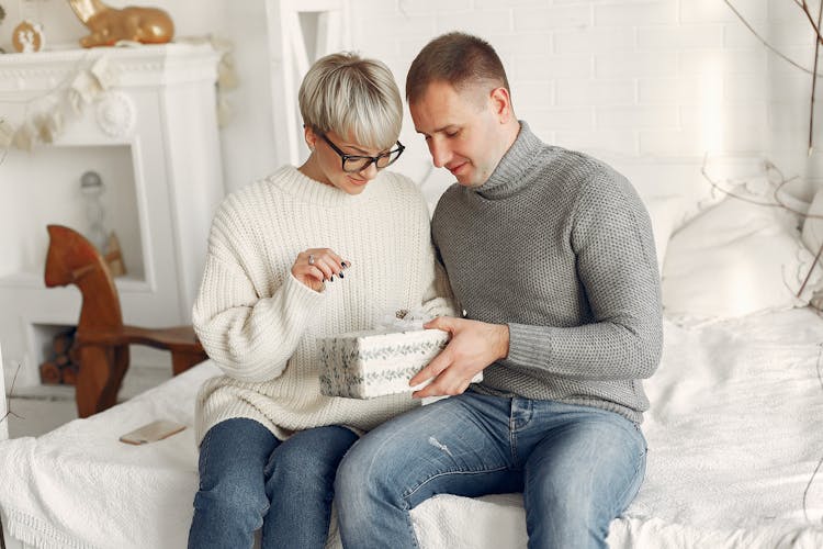 Couple Holding A Christmas Gift 