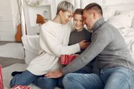 Woman in White Sweater Sitting Beside Man in Gray Sweater