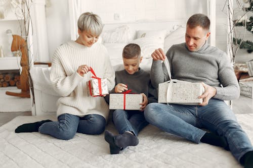 Family Opening Christmas Presents Together