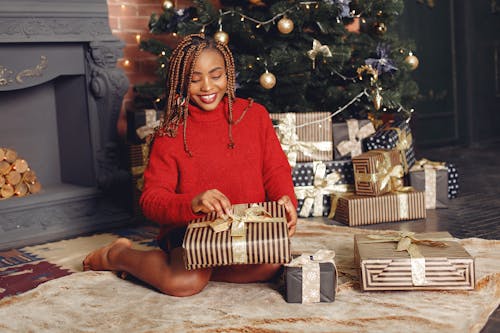 Woman Opening a Christmas Present 