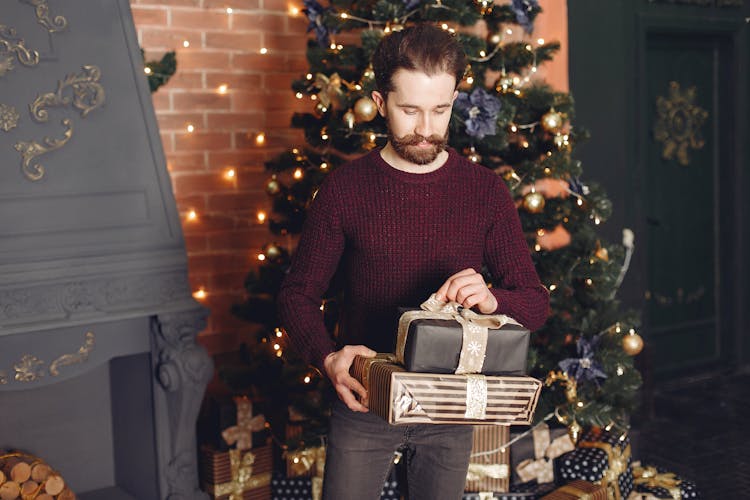 Man Holding Christmas Presents