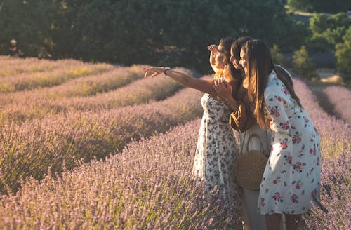 Women in Floral Dress Standing in Lavender Field