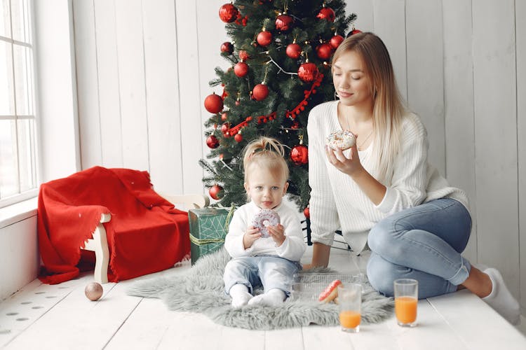 Woman And Child Eating Donuts