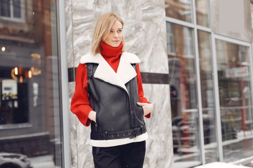 Free Fashionable woman poses in winter clothes on city street, blending style with warmth. Stock Photo
