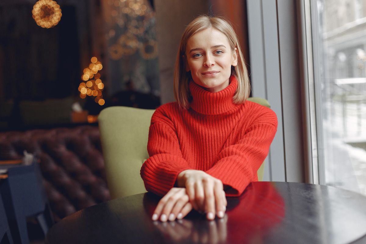woman wearing a red turtleneck sweater perfect for curvy fall wardrobe