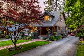 Brown and White Wooden House Near Green Trees