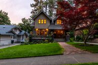 Brown and White Wooden House Near Green Trees Under White Sky