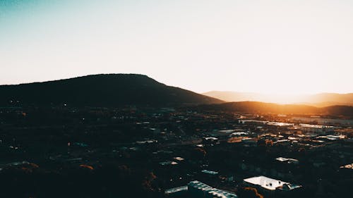 Sunset sky over mountain and town