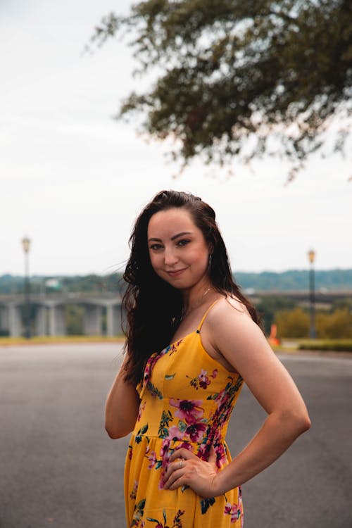 A Woman Wearing a Spaghetti Strap Floral Dress