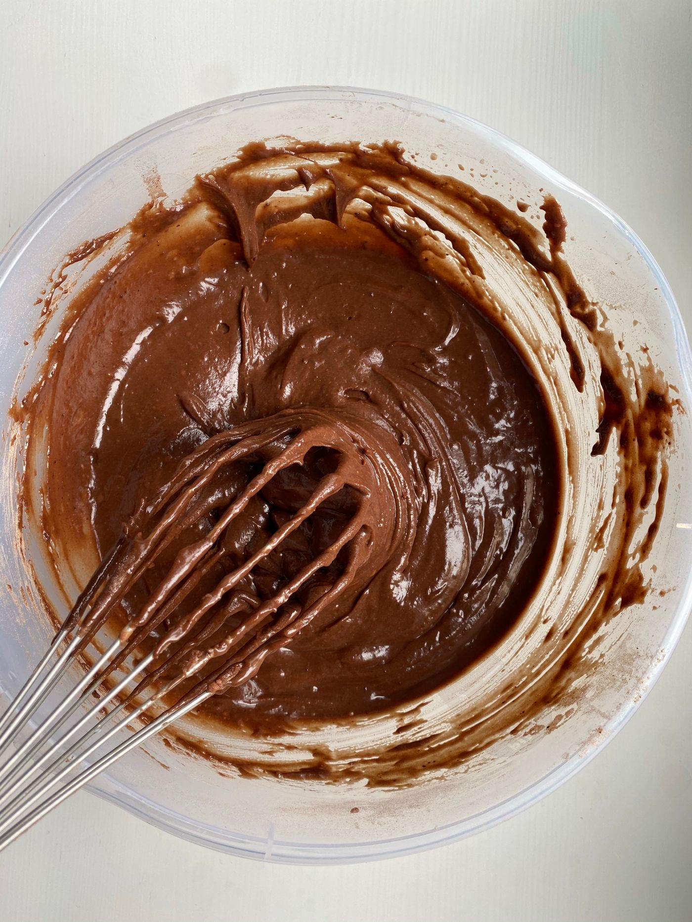 Smooth chocolate cake batter in a mixing bowl