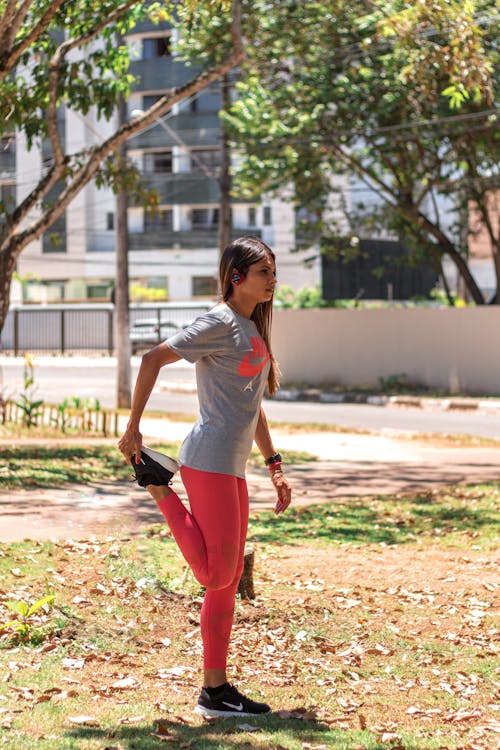 A Woman in Sportswear Exercising in the Park