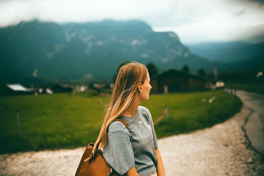 Free stock photo of road, mountains, woman, field