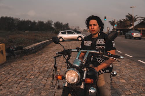 A Man Sitting on His Motorcycle