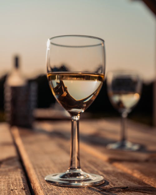 A Glass of Wine on Wooden Table 