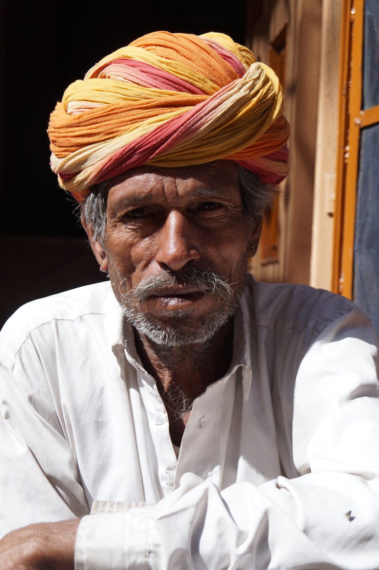 Portrait Of Old Man In Traditional Clothes