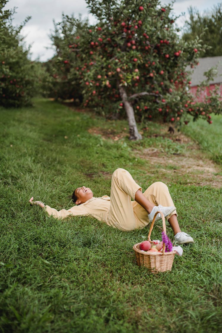 Young Hispanic Girl Resting On Grass