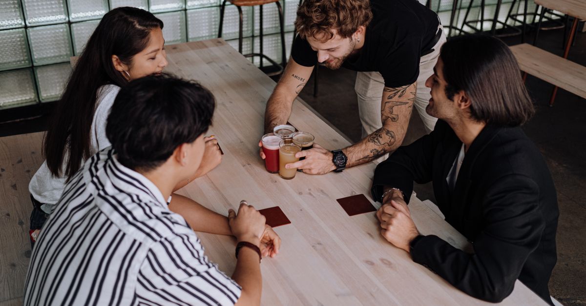 young diverse group having honest conversation about faith in a coffee shop