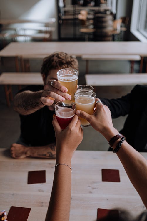 Free Friends Drinking Beer in a Restaurant  Stock Photo
