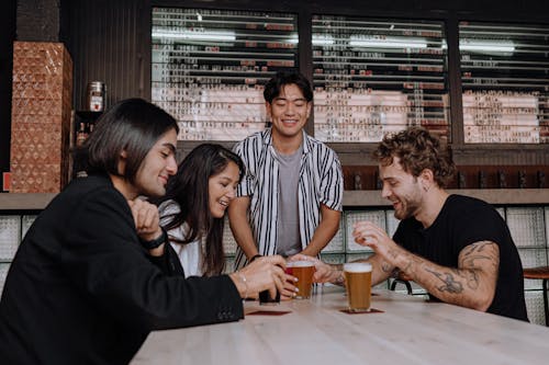 Photo of a Group of Friends Having a Drink