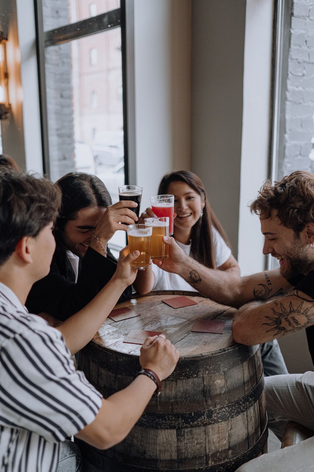 Franchise owners laughing and toasting drinks together