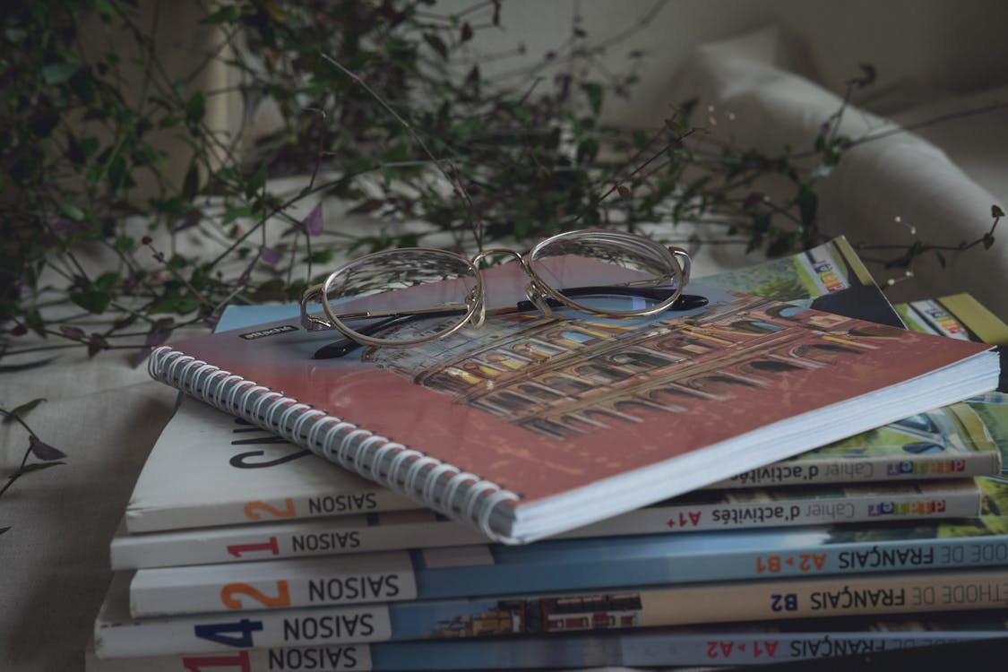 Free Student books with notepad and glasses Stock Photo