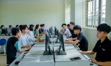 Young Boys Sitting in Front of the Computers in the Class