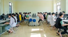 People Sitting on Blue Metal Chairs