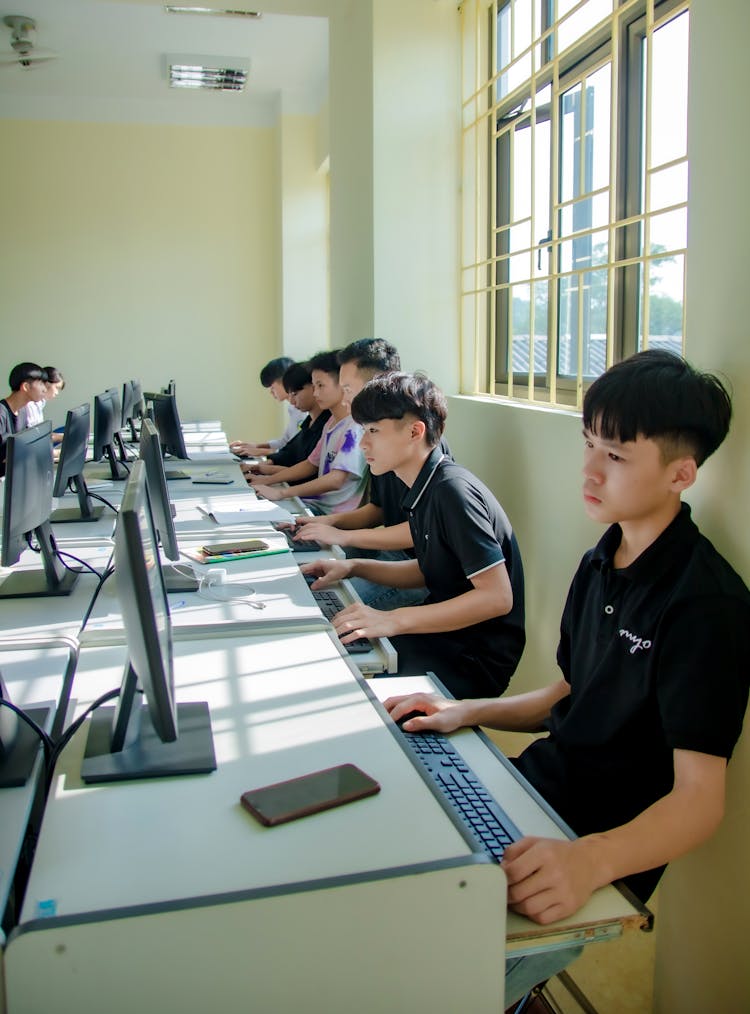 Students Using Computers In A Classroom