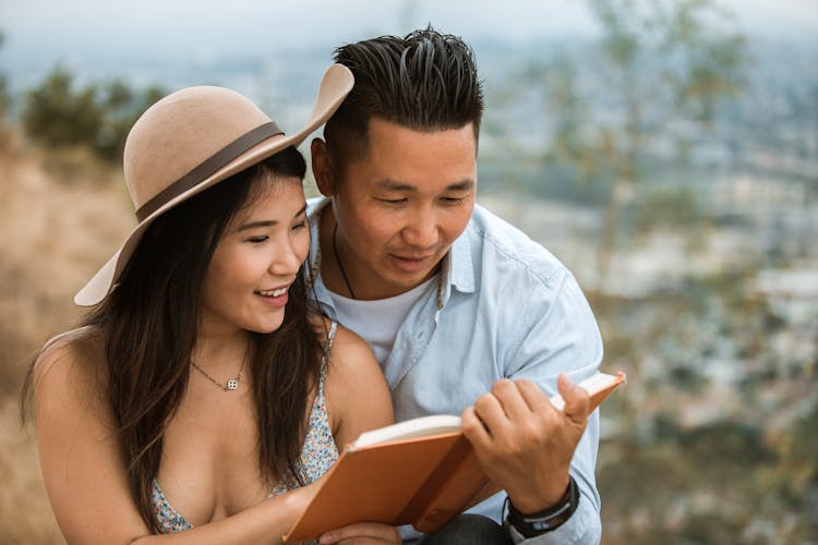 A Couple Reading A Book 