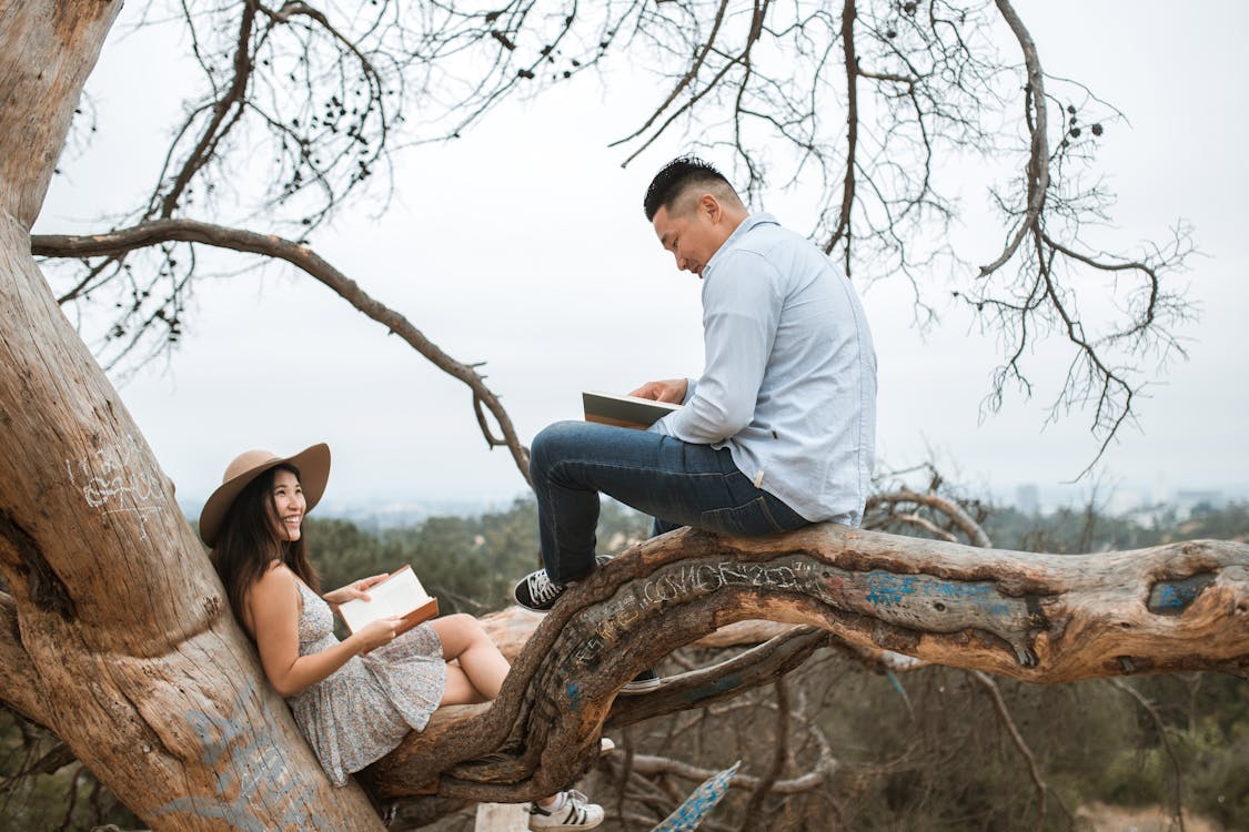 Free Couple Reading Books Outside Stock Photo