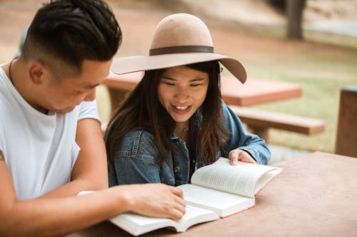 Free Couple Reading a Book Stock Photo