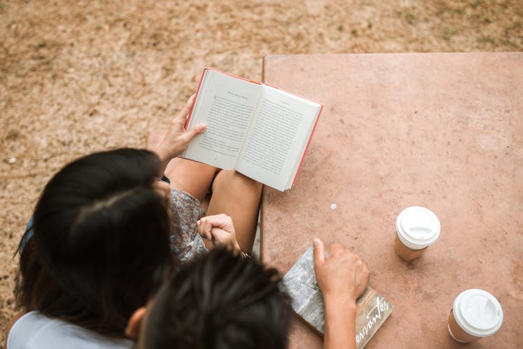 A Couple Reading A Book