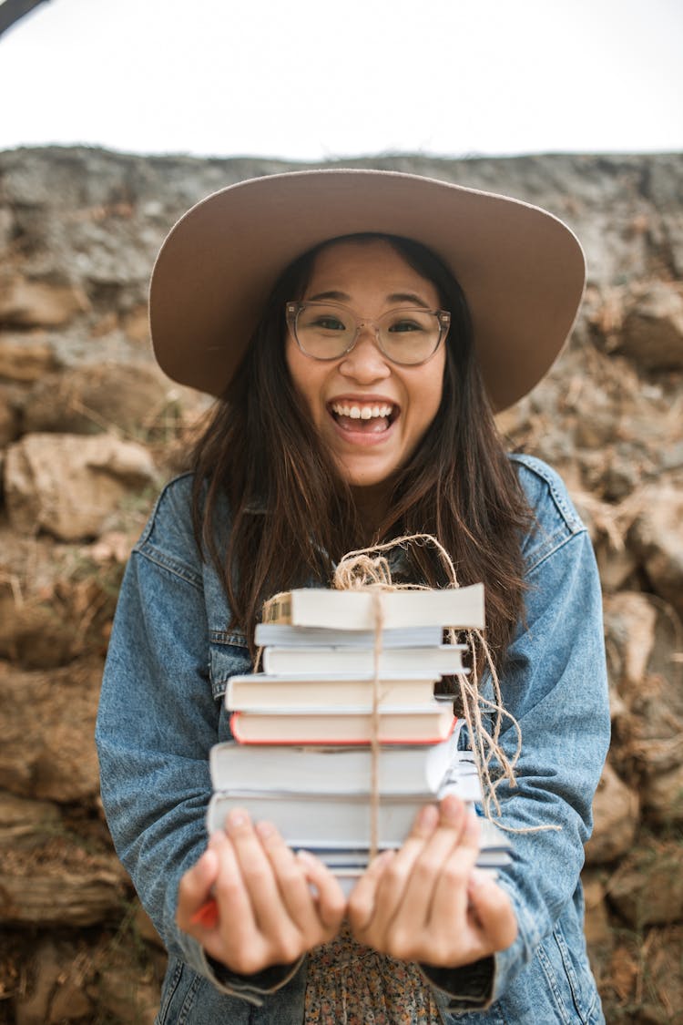 Portrait Of Woman Holding Books