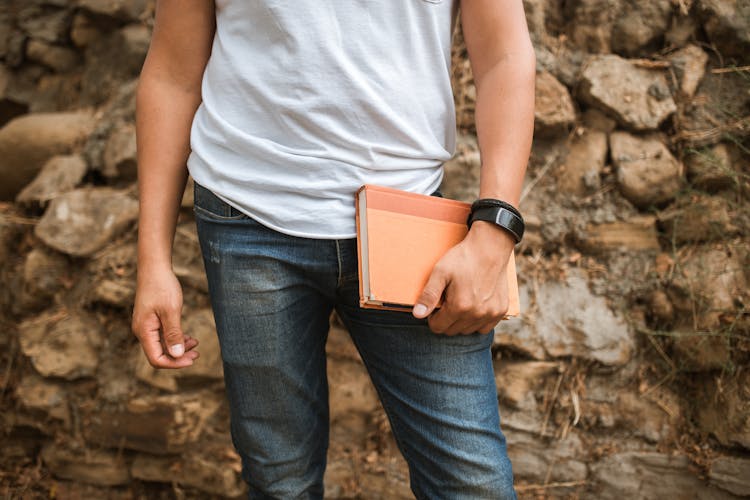 A Person Holding A Book