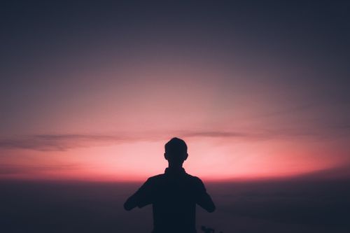Free Silhouette against a vibrant twilight sky in East Java, Indonesia. Captured at sunrise. Stock Photo