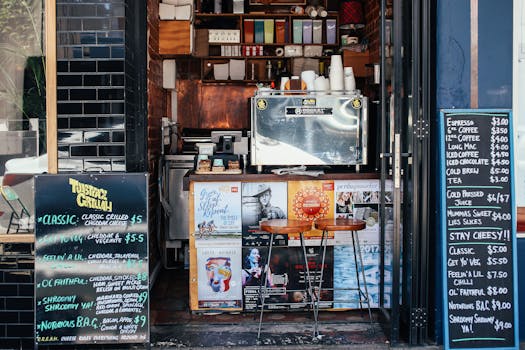 Open-front cafe with visible menu boards showcasing coffee and food options, inviting for street goers.