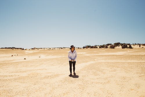 Woman Standing in Desert