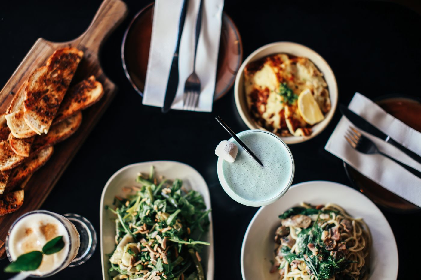 Vegetarian pasta and salad table setting