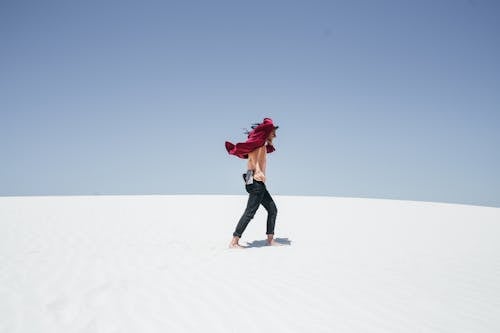 Man Walking Barefoot on Snow