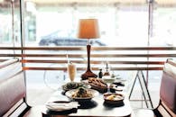 Brown Wooden Table With Plates and Bowls