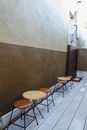 Brown and Black Chair Beside Brown Wall