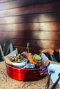 Red and White Plastic Bucket With Food
