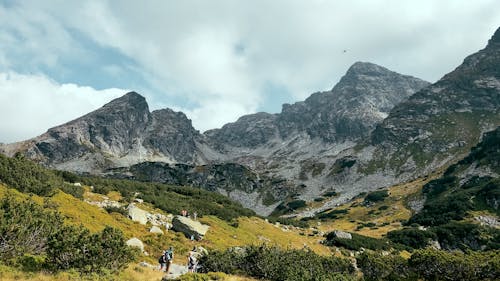 People Hiking in Mountains