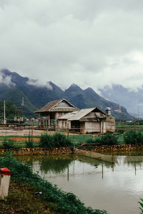 House with Lake near Mountain Foot