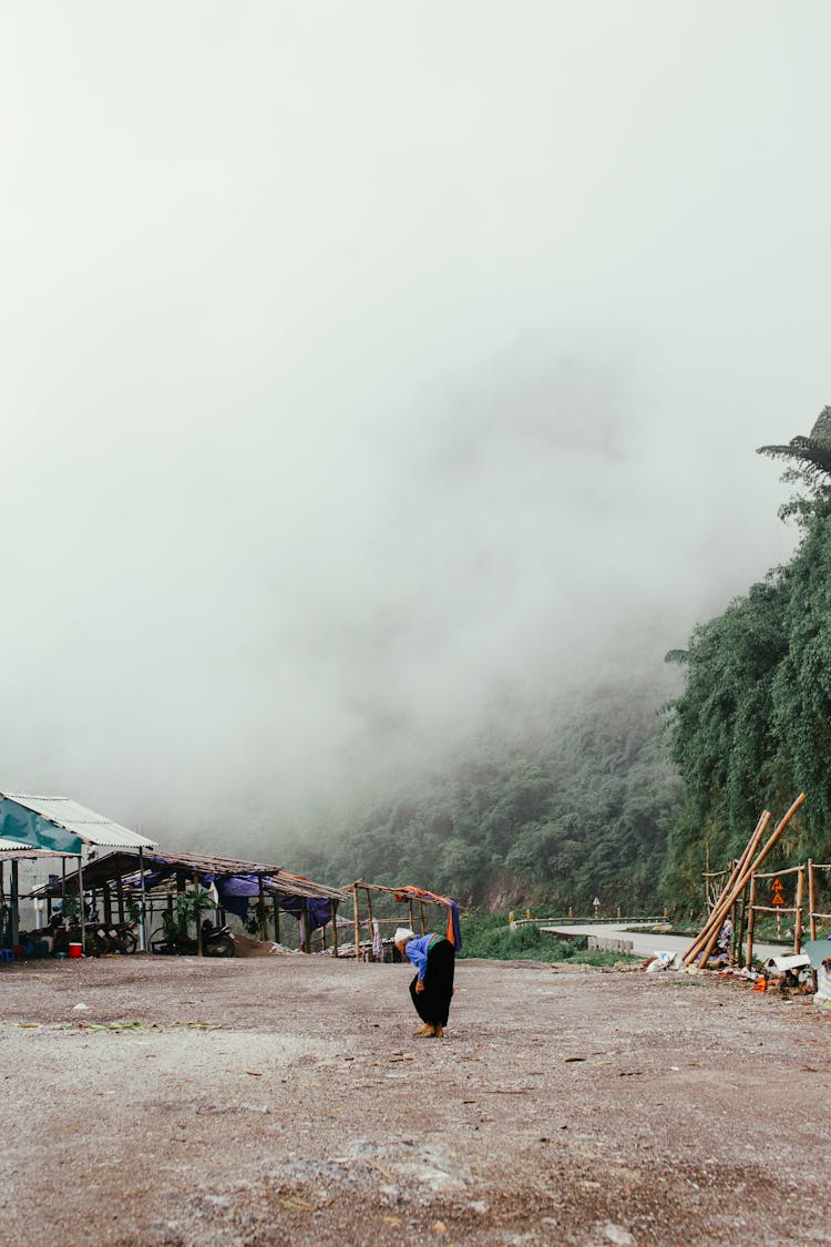 Senior Woman Walking In Village