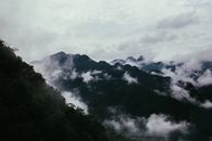 Green Trees on Mountain Under White Clouds
