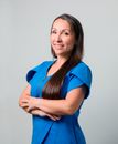 Woman in Blue Polo Shirt Smiling