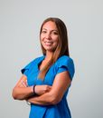Woman in Blue Polo Shirt Smiling